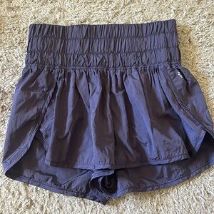 Lightly worn free people “The Way Home” athletic shorts. S in blue